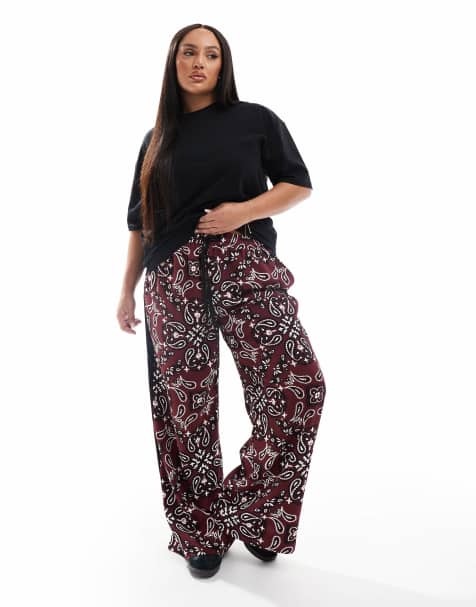 ASOS DESIGN Curve pull on pants with contrast panel in dark cherry bandanna print - view 1