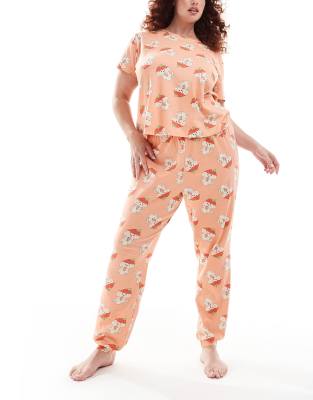 ASOS DESIGN Curve - Pyjama in Rosa mit Cavachon-Hunde-Erdbeermuster, bestehend aus T-Shirt und Hose mit Bündchen