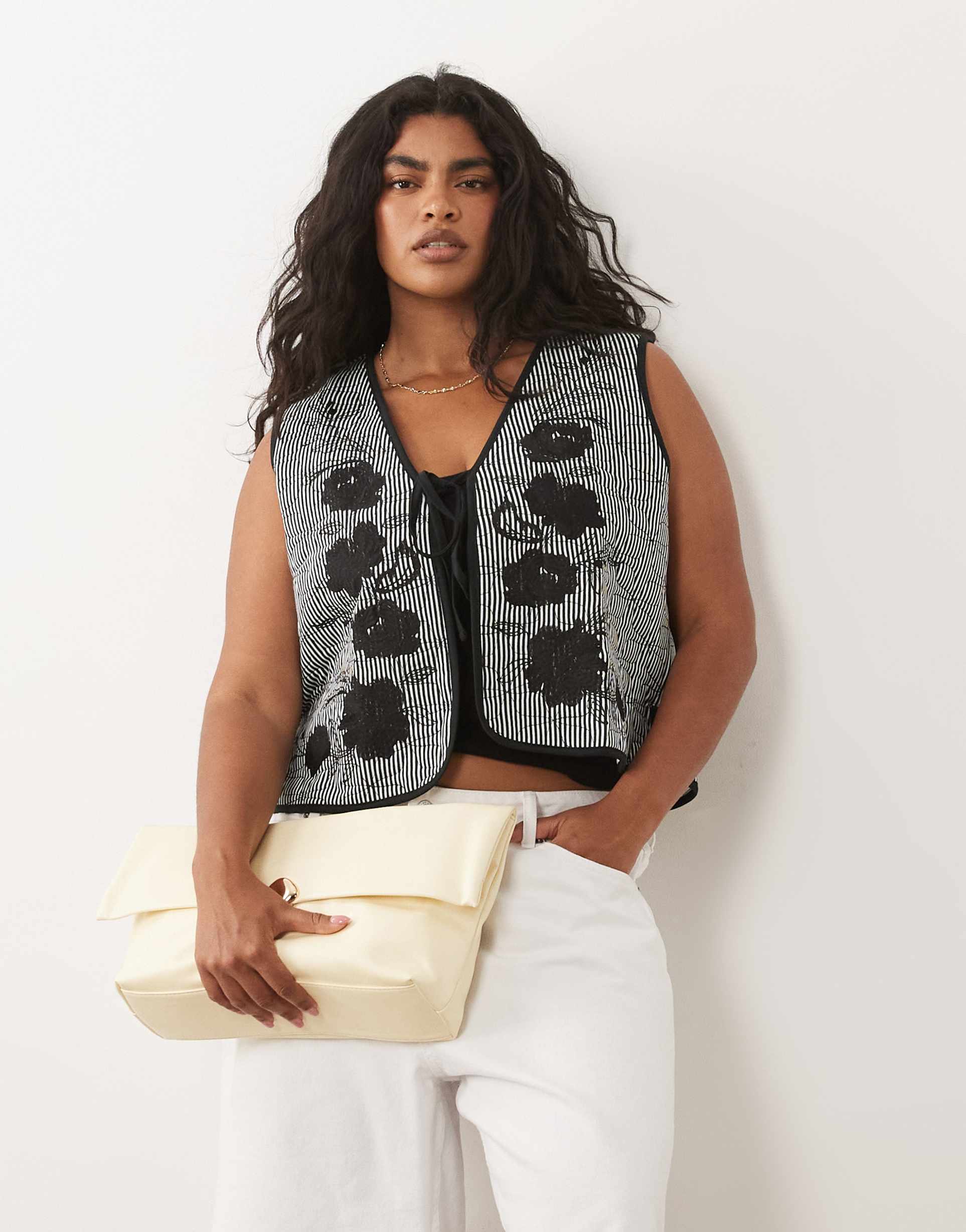 asos design curve quilted striped vest with embroidered floral design in black and white