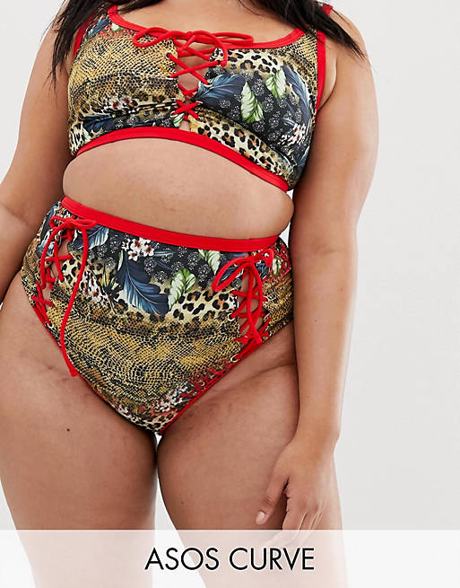 ASOS DESIGN Curve recycled lace up contrast bind high waist bikini bottom in leopard tropical print