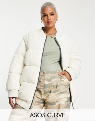 ASOS DESIGN Curve reversible quilted bomber jacket in khaki and cream