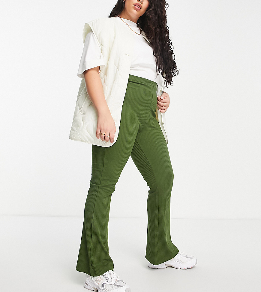 Plus-size trousers by ASOS DESIGN Add-to-bag material High rise Elasticated waist Flared slim fit