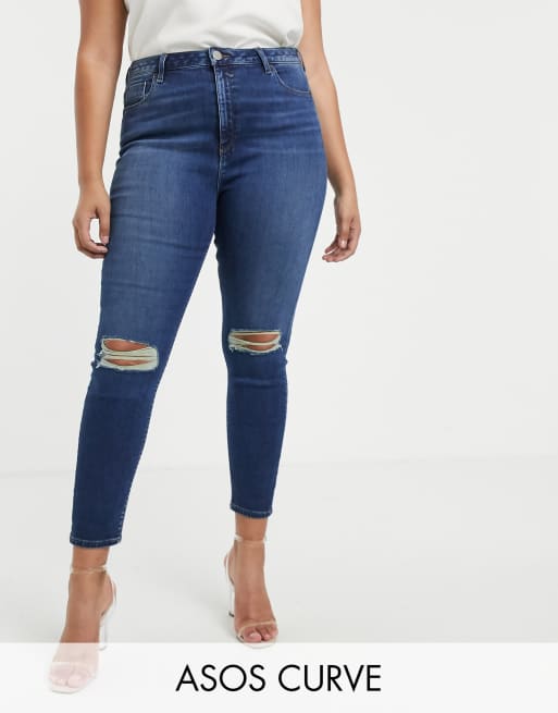 ASOS DESIGN Curve – Ridley – Enge Jeans mit hoher Taille und Zierrissen am Knie in dunkelblauer Stone-Waschung