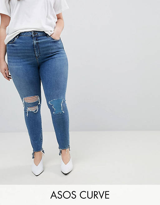 ASOS DESIGN Curve Ridley high waist skinny jeans in extreme mid wash with busted knee and rip & repair detail