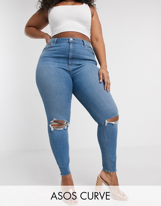 ASOS DESIGN Curve high rise ridley 'skinny' jeans in vintage lightwash blue with slash knee rips and raw hem