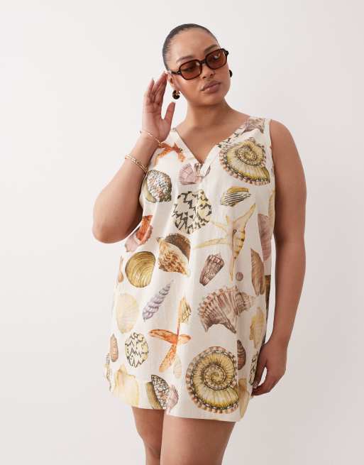 ASOS DESIGN Curve - Robe babydoll courte en coton et lin à col V et imprimé coquillages - Multicolore