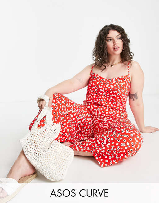 ASOS DESIGN Curve – Röd, småblommig jumpsuit i oversize med smala axelband och knytning baktill