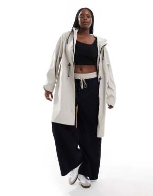 ASOS Curve ASOS DESIGN Curve rubberised longline parka with drawstring detail in neutral
