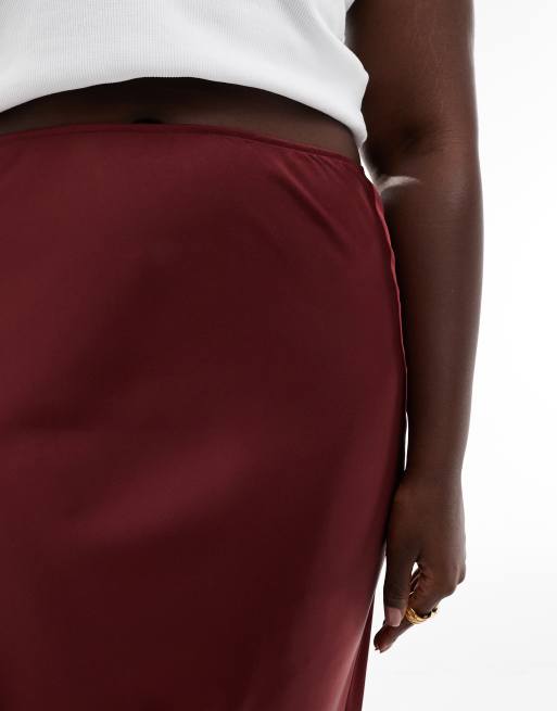 ASOS DESIGN Curve satin bias midi skirt in burgundy ASOS