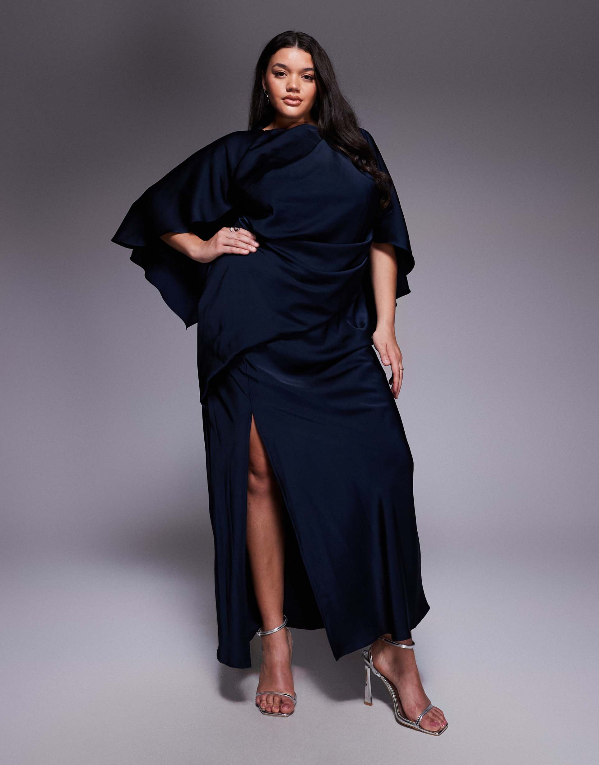 asos design curve satin ruffle cape sleeves maxi dress with open back detail and high slit in navy