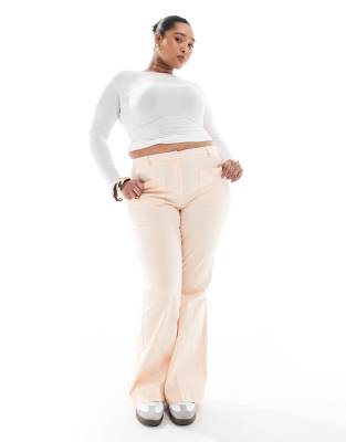 ASOS DESIGN Curve - Schlaghose in Apricot mit aufgesetzter Tasche-Orange
