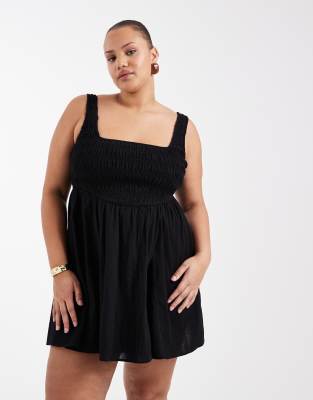 ASOS DESIGN Curve - Selina - Gesmoktes Sommerstrandkleid in Minilänge aus strukturierter Baumwolle in Schwarz