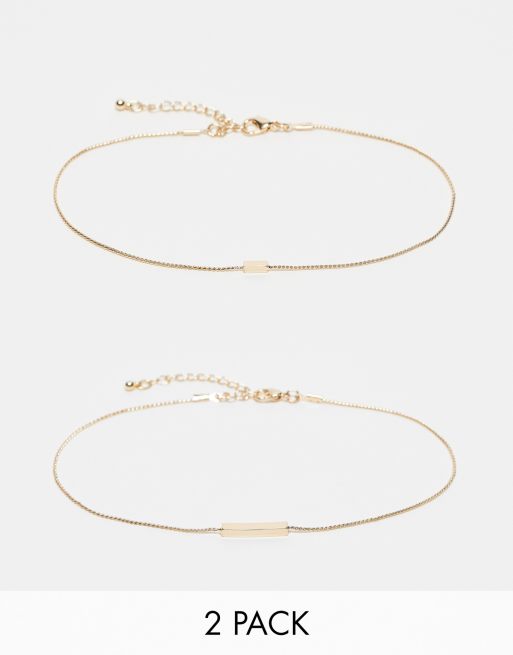 ASOS DESIGN Curve - Set van 2 enkelbandjes met staafje in goudkleur