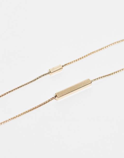 ASOS DESIGN Curve - Set van 2 enkelbandjes met staafje in goudkleur, 2 van 4