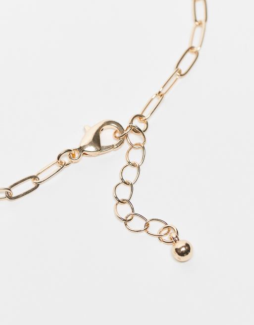 ASOS DESIGN Curve - Set van 4 fijne schakelarmbanden in goudkleur, 3 van 3