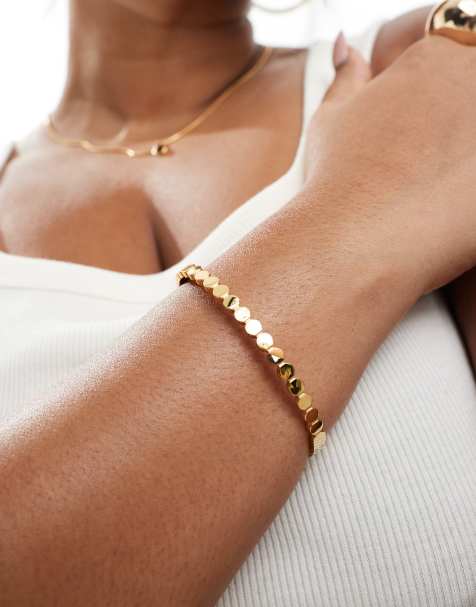ASOS DESIGN Curve - Skinny armband met cirkels van waterbestendig roestvrij staal in goudkleur - view 1