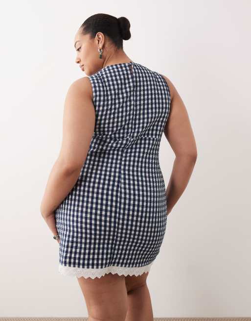 ASOS DESIGN Curve slash neck mini sundress with sculpted bust and broderie hem in navy gingham , 2 of 4
