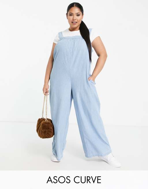 ASOS DESIGN Curve - Smock-jumpsuit i blød denim i lys vask