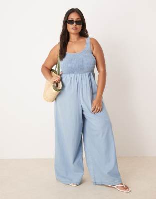 ASOS DESIGN Curve soft denim wide leg jumpsuit with shirred body in light wash-Blue