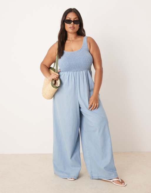 ASOS DESIGN Curve soft denim wide leg jumpsuit with shirred body in midwash blue