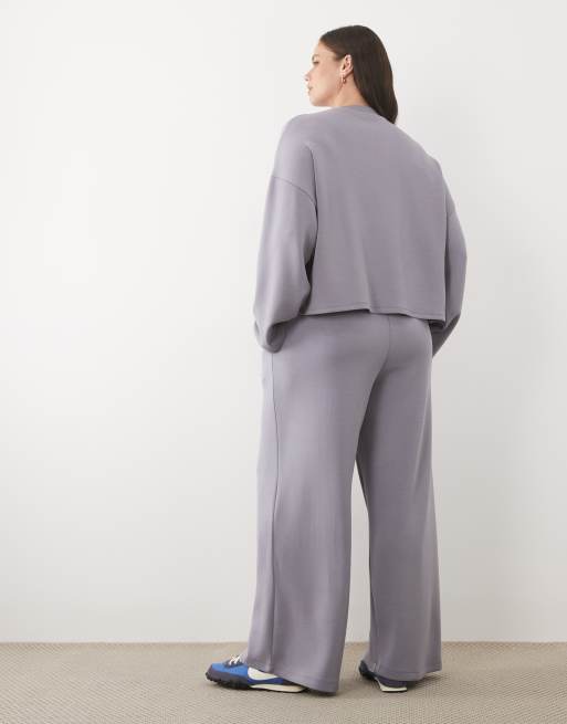 ASOS DESIGN Curve soft touch cupro wide leg trackies in black, 4 of 5