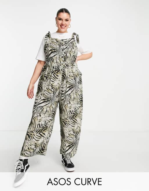 ASOS DESIGN curve spun tie shoulder button front dungaree in animal print