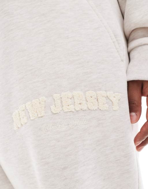 ASOS DESIGN Curve straight leg sweatpants with chenille New Jersey graphic in heathered oatmeal - part of a set