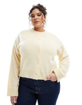 ASOS DESIGN Curve - Strickjacke in Buttermilchgelb mit Rundhalsausschnitt