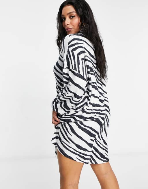 ASOS DESIGN Curve super soft long sleeve roll neck mini jumper dress in zebra print, 2 of 4