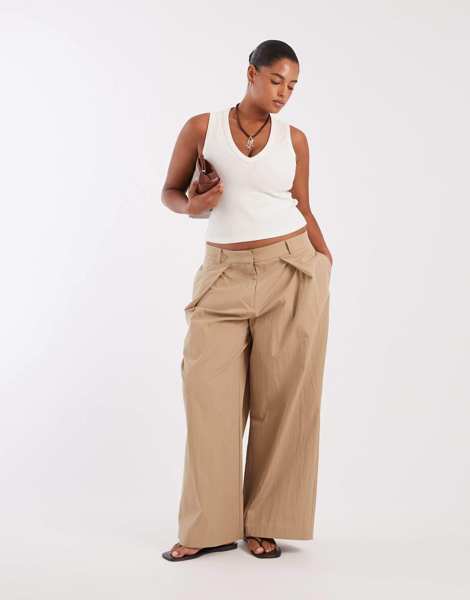 ASOS DESIGN Curve Tailored pleat front detail wide leg trousers in sponge green