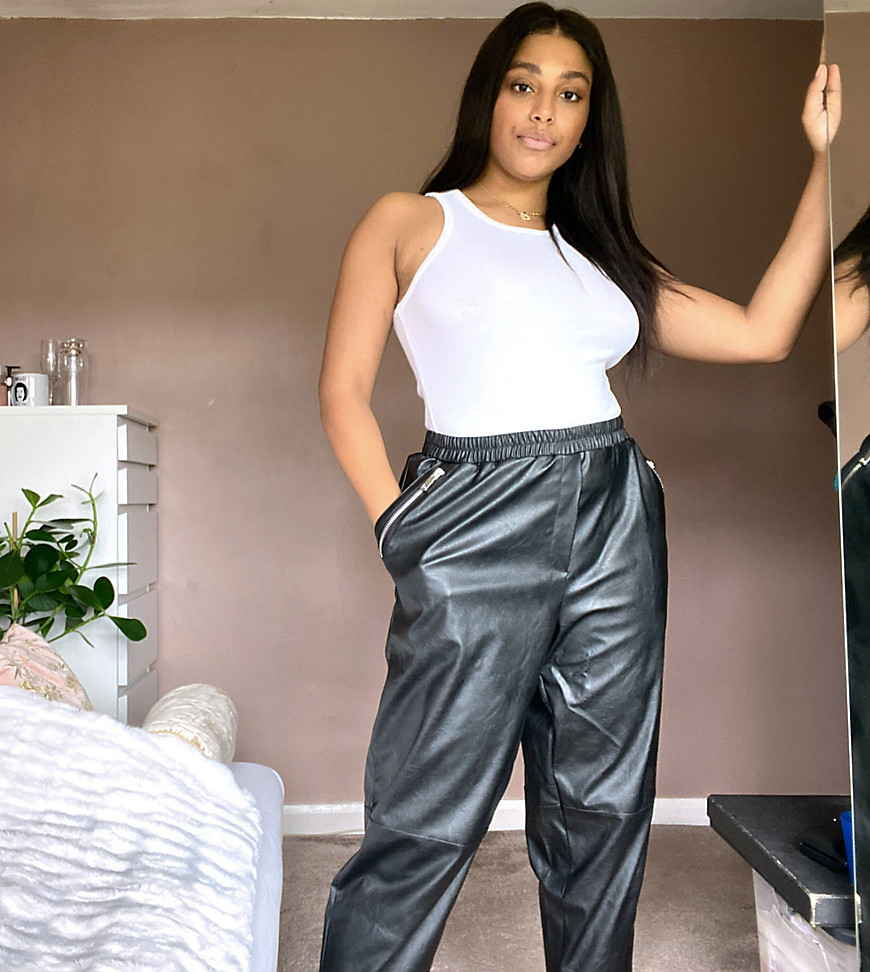 Plus-size trousers by ASOS DESIGN Worn and shot by one of our models at home High rise Elasticated waistband Zip-side pockets Cropped length Regular, tapered fit A standard cut around the thigh with a narrow shape through the leg #AtHomeWithASOS