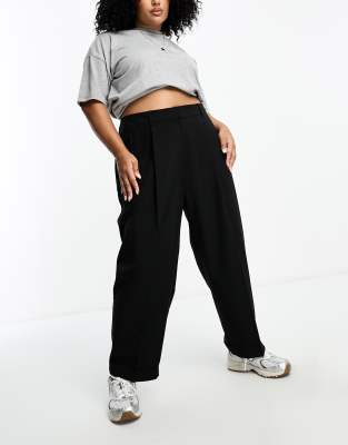 ASOS DESIGN Curve tapered tailored pants with turn up hem in black