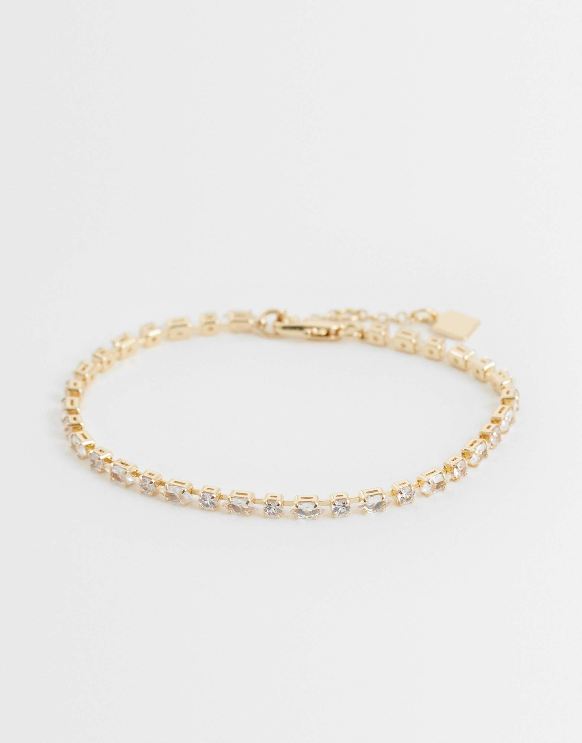 asos design curve tennis bracelet with cubic zirconia stone details in gold tone in gift bag