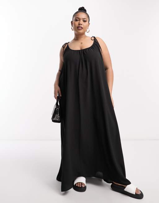 Trapeze dress with side pockets in black