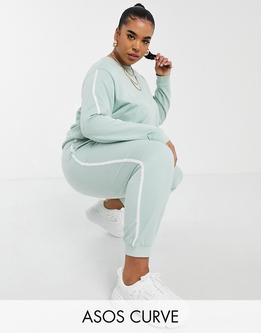 ASOS DESIGN Curve tracksuit sweat / basic jogger with contrast binding in organic cotton in sage green