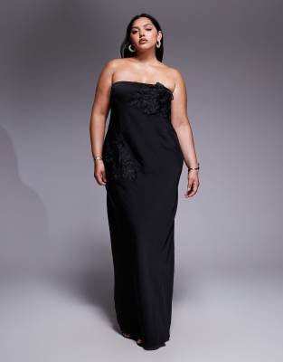 ASOS DESIGN Curve - Trägerloses Maxikleid in Schwarz mit Blumenapplikation