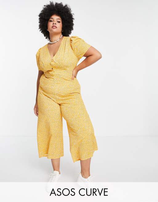 ASOS DESIGN Curve - Tuta jumpsuit da giorno color senape a fiori 