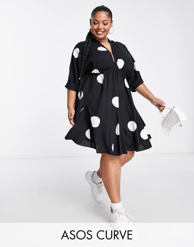 ASOS DESIGN Curve V-front V-back godet skater mini dress in black and white dot print