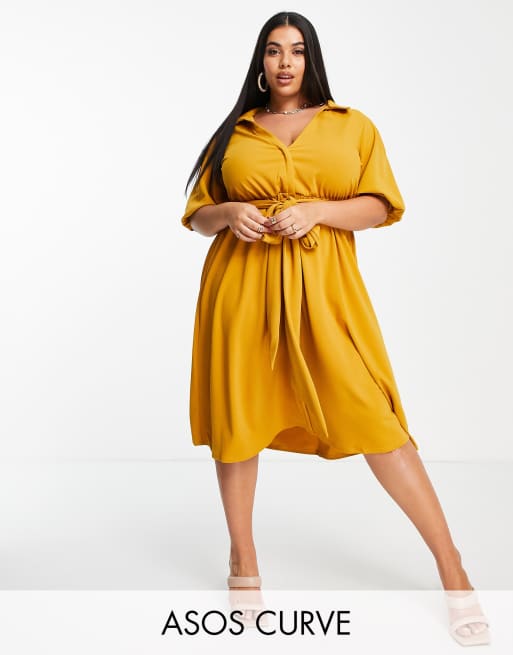ASOS DESIGN Curve - Vestito camicia stile skater midi color senape avvolgente con cintura in tessuto