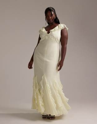 ASOS DESIGN Curve - Vestito da damigella lungo taglio sbieco color giallo tenue con volant sulle maniche e sul fondo a godet