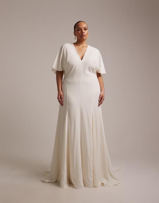 ASOS DESIGN Curve - Vestito lungo da sposa con maniche a mantella e godet color avorio