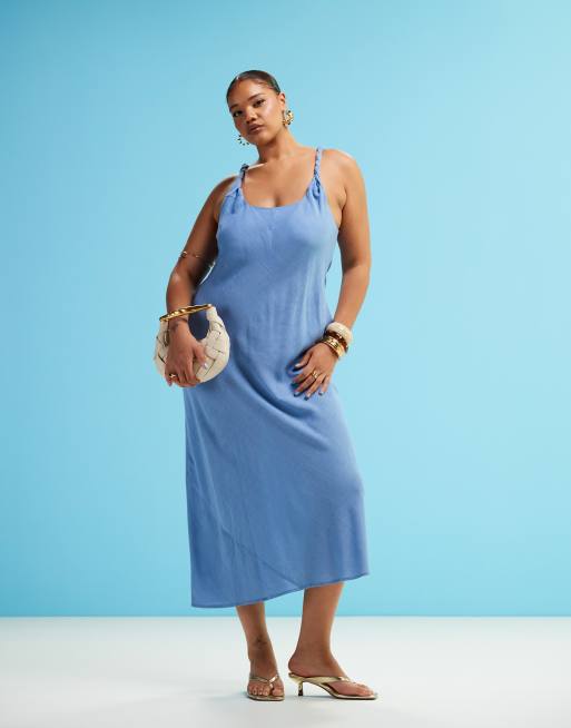 ASOS DESIGN Curve - Vestito lungo effetto lino con taglio sbieco e spallina incrociata blu denim