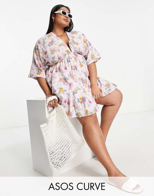 ASOS DESIGN Curve - Vestito skater corto godet con scollo a V davanti e dietro con stampa a fiori estiva 