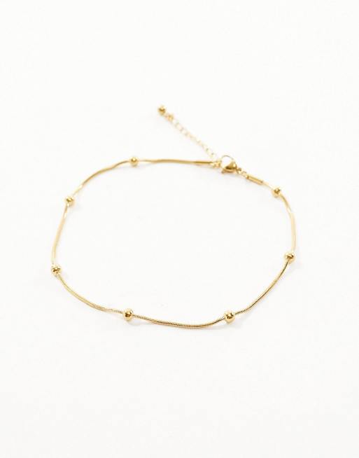 ASOS DESIGN Curve waterproof stainless steel anklet with dot chain design in gold tone, 2 of 4
