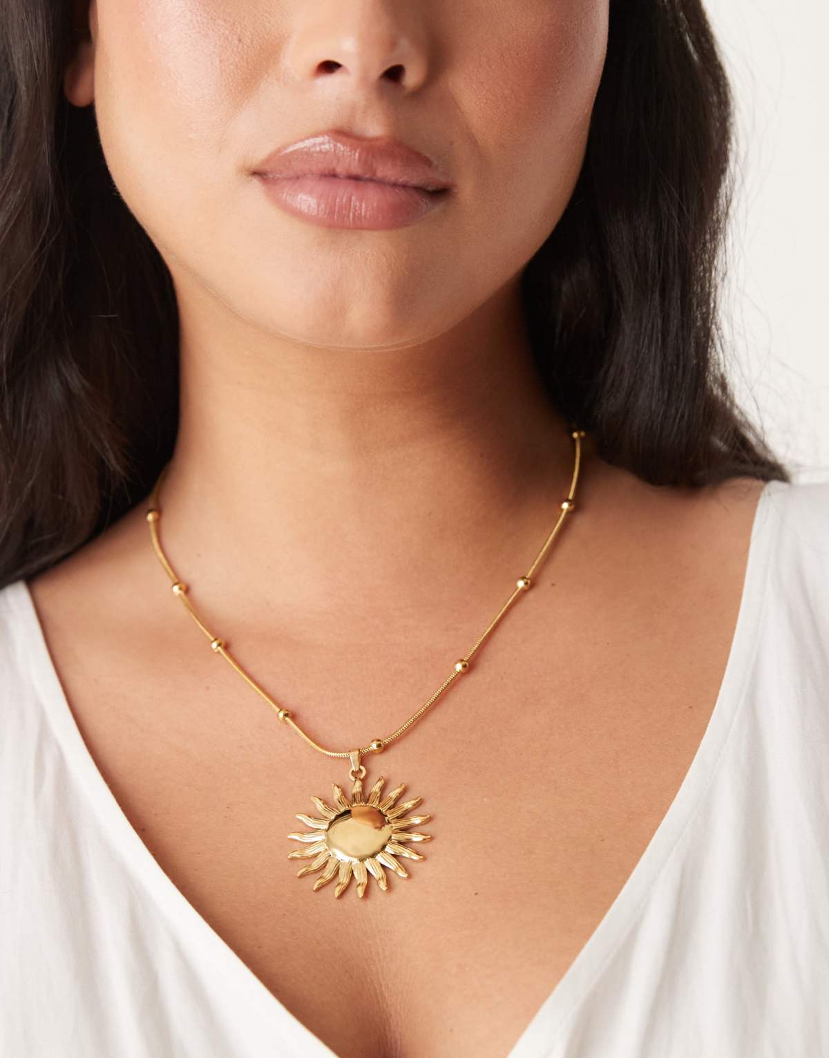 ASOS DESIGN Curve waterproof stainless steel necklace with sun pendant in gold tone