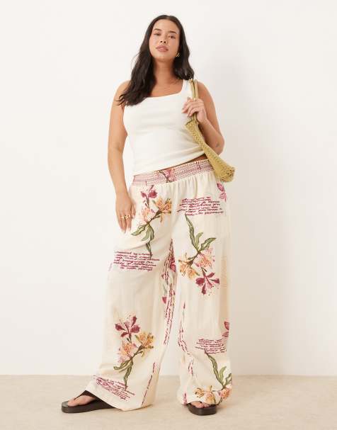 ASOS DESIGN Curve linen blend pull on wide leg trousers with shirred waist detail in floral print