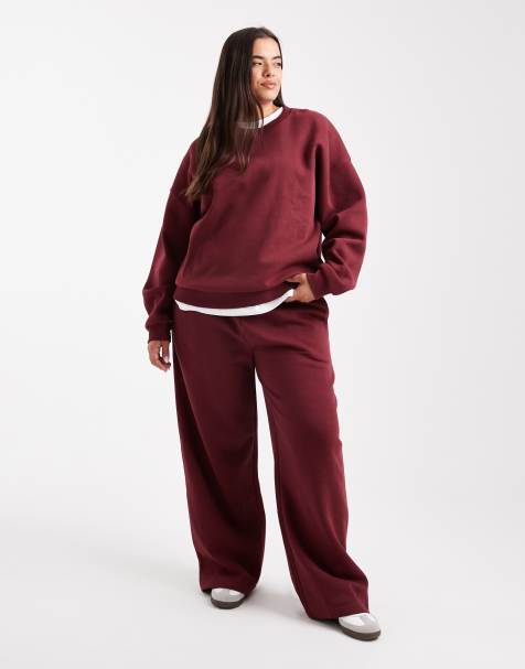 ASOS DESIGN Curve wide leg brushback trackies in burgundy - view 1