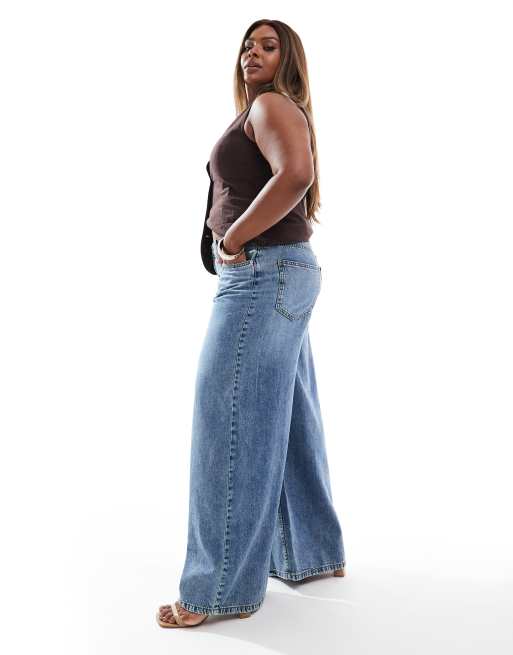 ASOS DESIGN Curve wide leg jeans in midwash blue