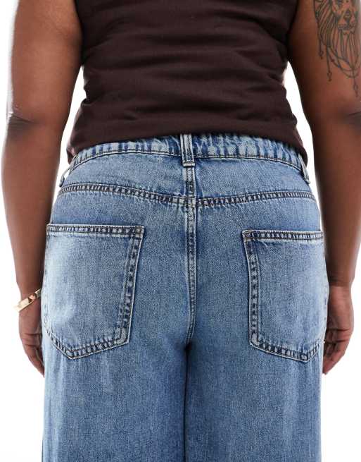 ASOS DESIGN Curve wide leg jeans in midwash blue