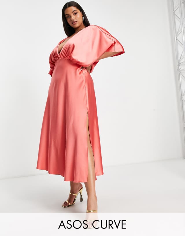 ASOS DESIGN Curve wrap front batwing sleeve satin midi dress in coral